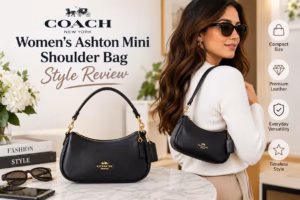 Coach Women's Ashton Mini black leather shoulder bag with gold hardware displayed beside a model wearing it.
